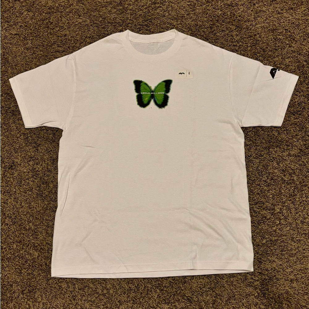 Above Millions Tee